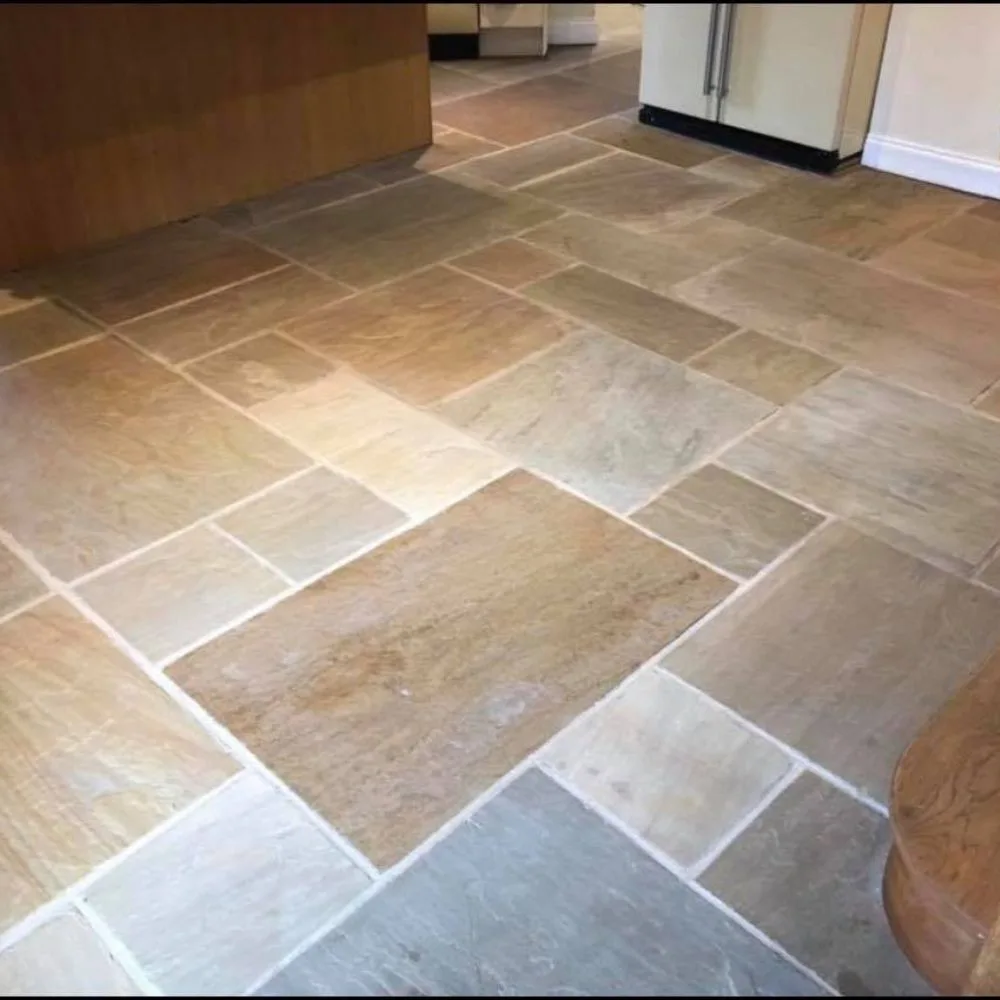 Natural slate stone floor in process of being cleaned and restored