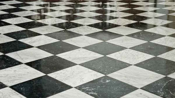 Black and white diamond-tile floor restored to a deep clean finish